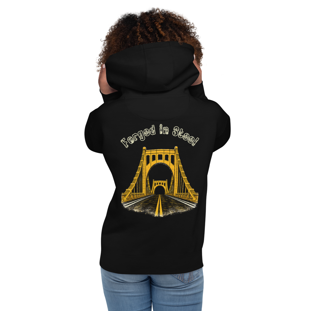 Woman wearing a black hoodie with "Forged in Steel" Bridge design on the back. 