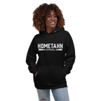 Woman wearing a black hoodie with "HOMETAHN APPAREL" logo on front.