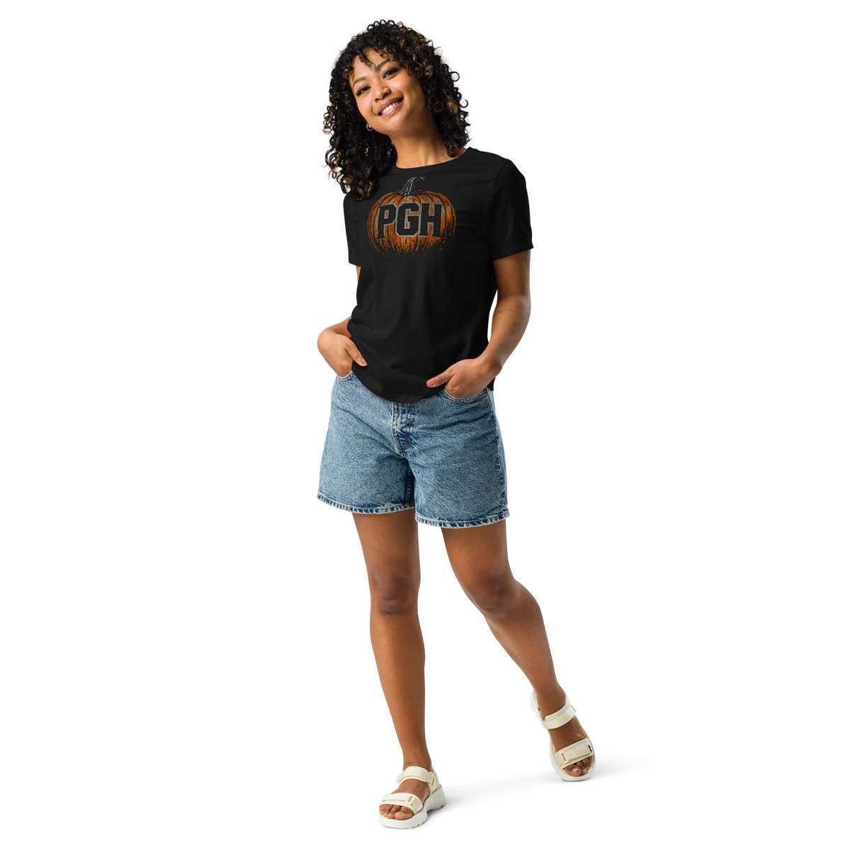 Woman wearing a black t-shirt with an orange pumpkin and "PGH" on it.
