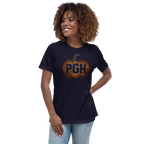 Woman wearing a NAVY BLUE t-shirt with an orange pumpkin and the letters "PGH" carved into it.
