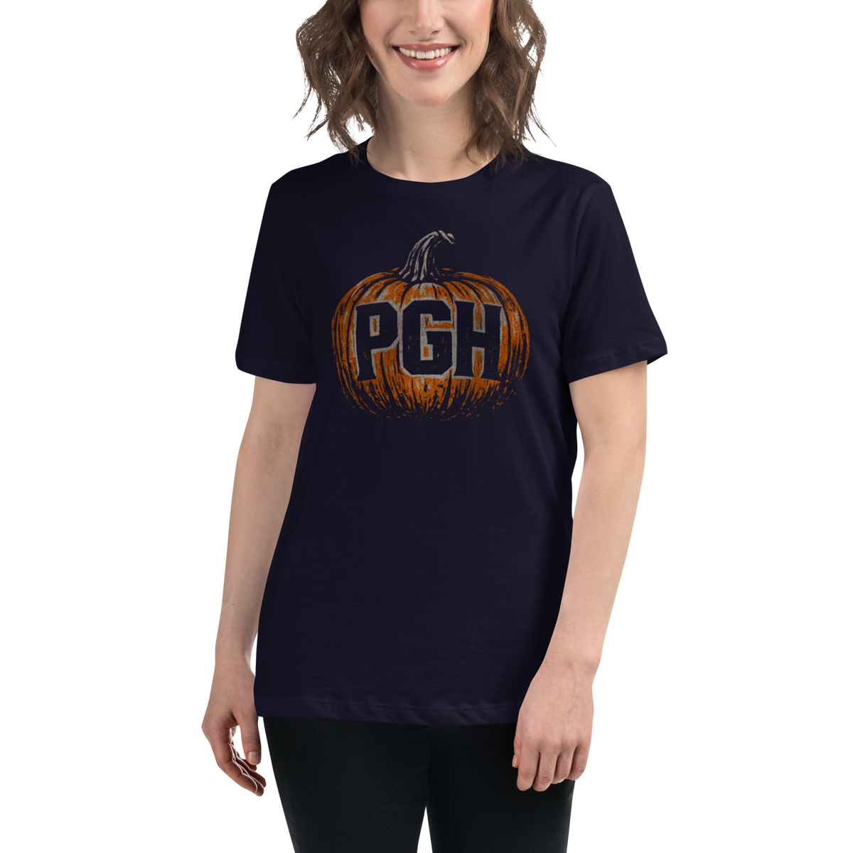 Person wearing a navy blue t-shirt with 'PGH' text on an orange pumpkin.